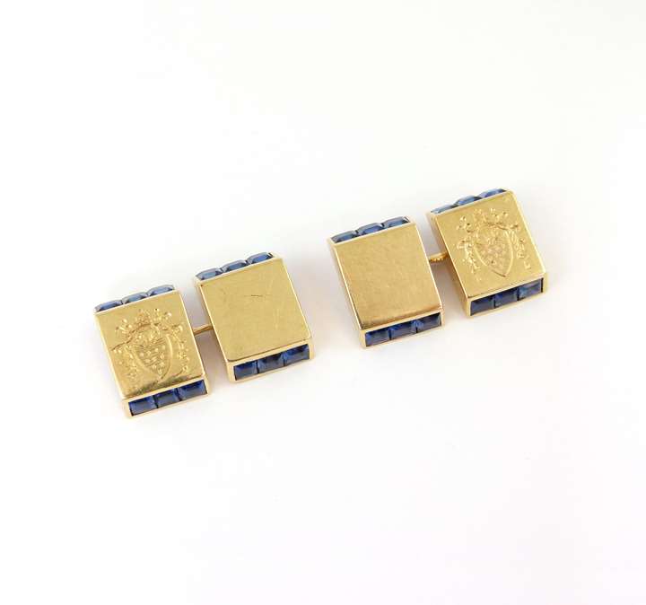 Pair of sapphire set and gold rectangular panel cufflinks with engraved coat of arms